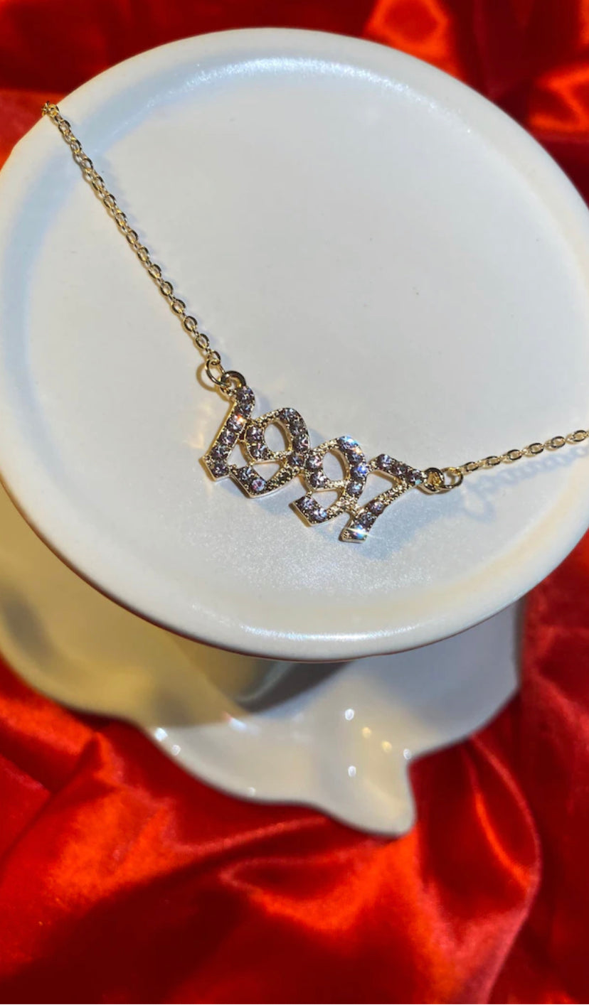 Iced out year necklace